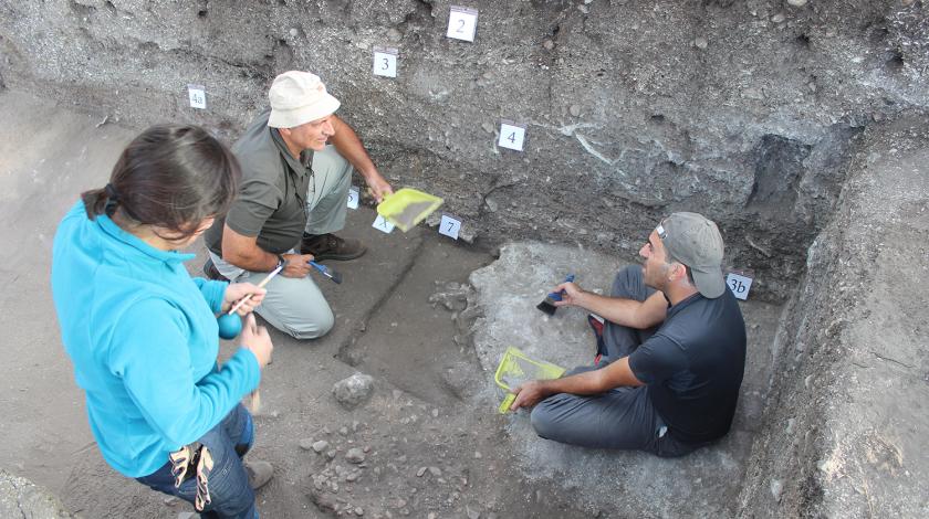 Volunteers conducting participating in a hands-on archaeological dig 
